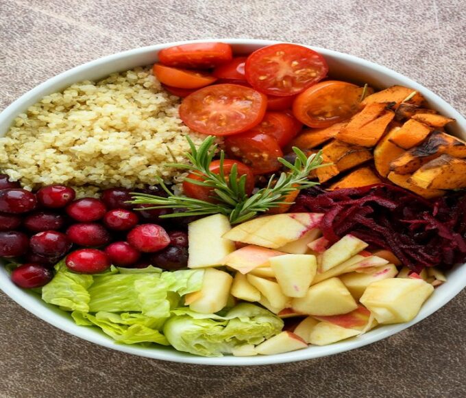 Balanced bowl with fruits, vegetables, whole grains, and plant foods representing everyday healthy eating