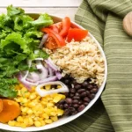 Balanced meal plate with vegetables, grains, and protein showing simple meal planning for a balanced diet