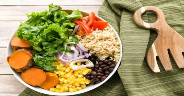 Balanced meal plate with vegetables, grains, and protein showing simple meal planning for a balanced diet