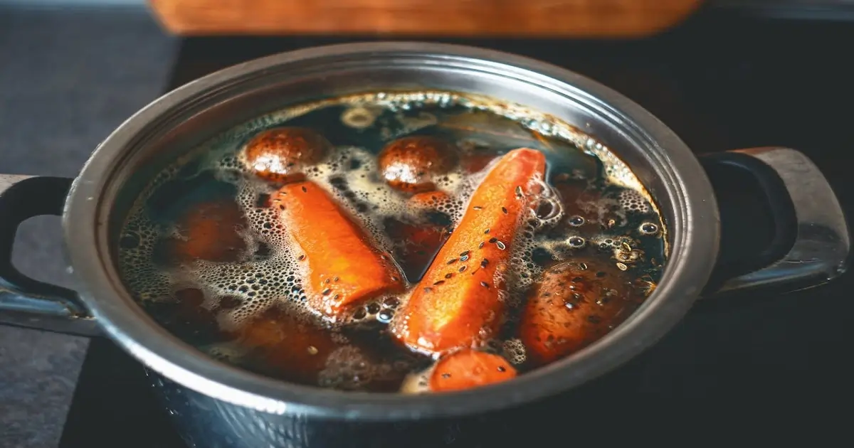 Boiling vegetables in water showing how cooking methods can influence nutrient retention