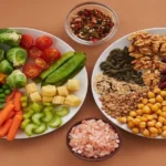 Balanced plate with vegetables, legumes, grains, nuts, and seeds that help improve food quality and diet diversity.