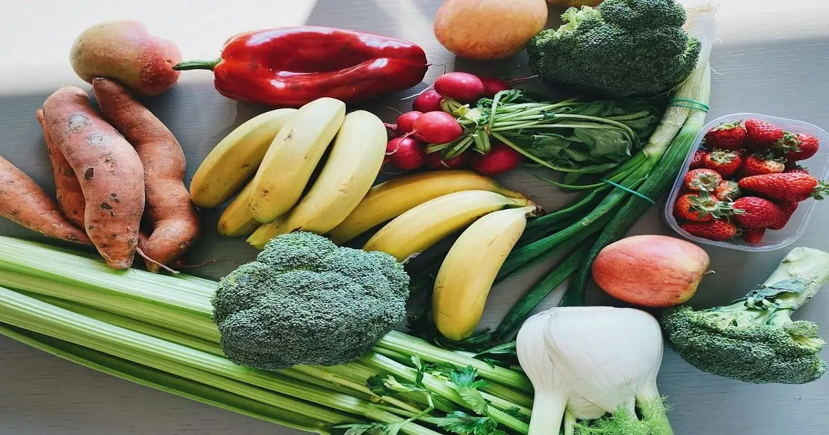 Fresh fruits and vegetables including broccoli, bananas, strawberries, and peppers that help improve food quality.