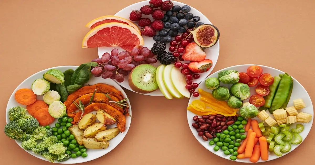 Balanced plates with fruits, vegetables, legumes, and grains showing improved food quality in everyday meals. 