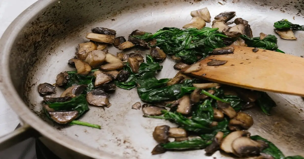 Sautéing vegetables in a pan showing how cooking methods can influence nutrient retention